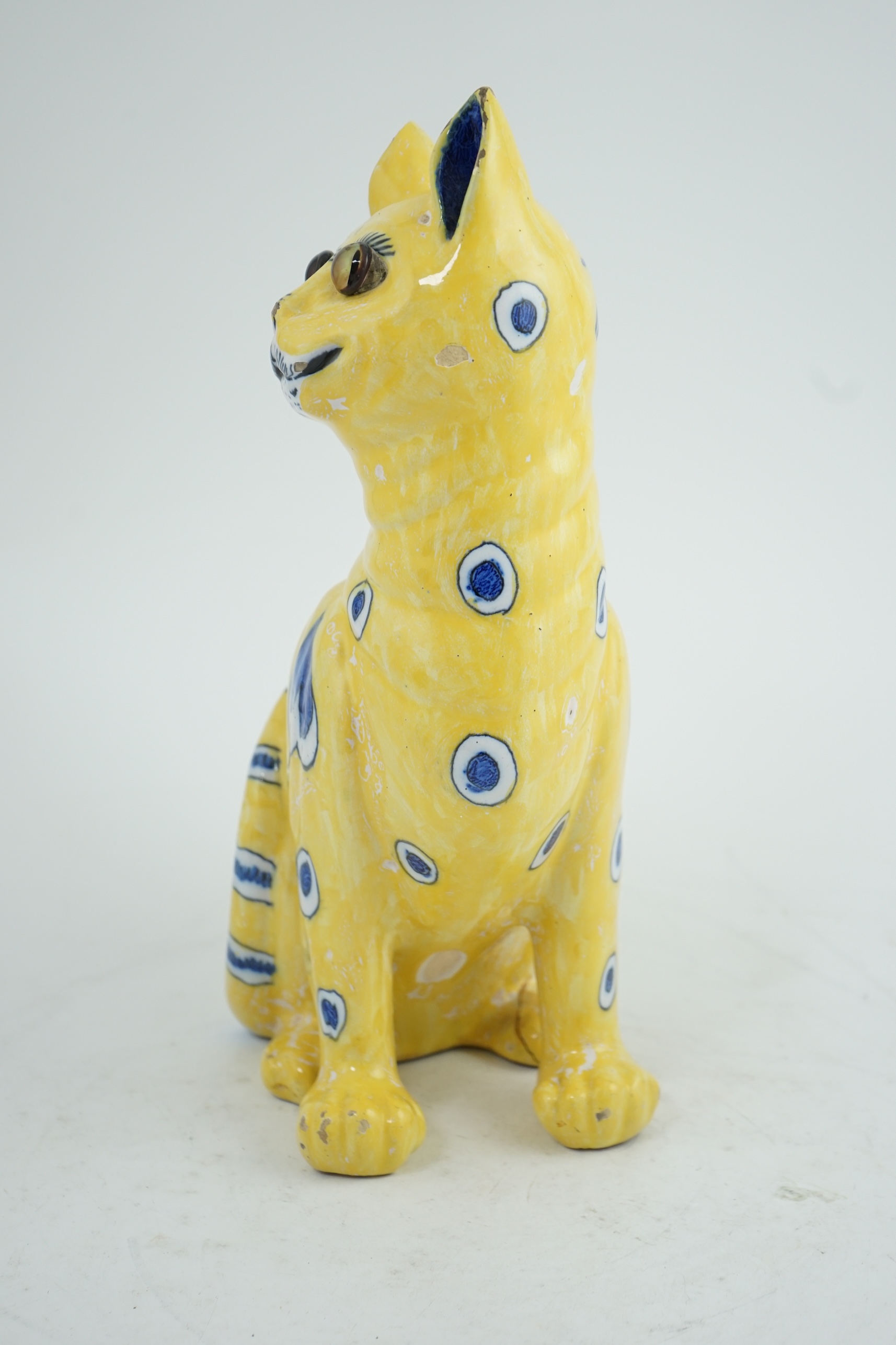 A Gallé yellow faience model of a seated smiling cat, c.1885